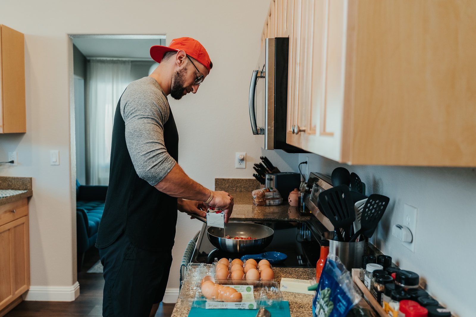 David cooking eggs in the kitchen