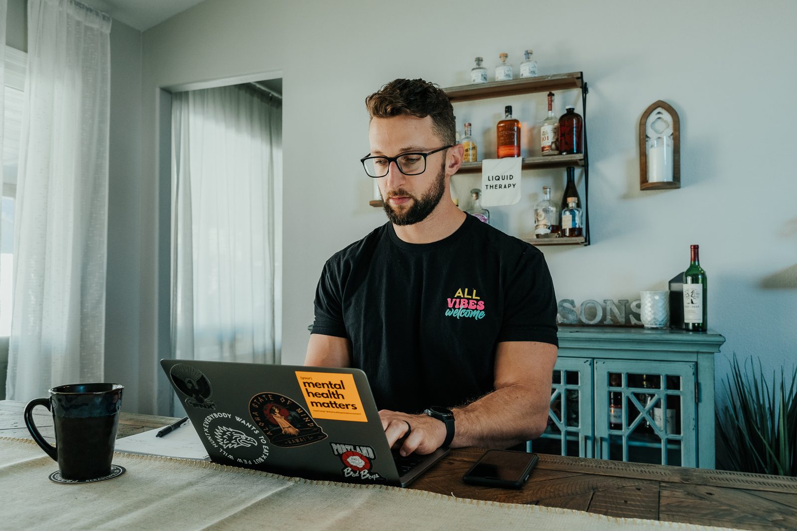 David working on his laptop